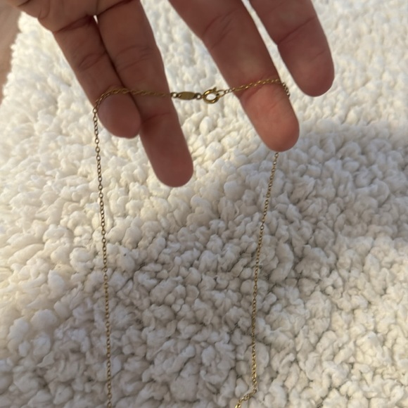 Dainty gold necklace with simple circle and singular diamond. - Picture 3 of 4